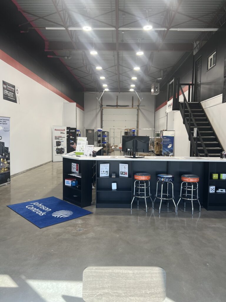 Sales counter at the Canada Controls building automation branch in Edmonton, Alberta, with control product displays and seating for contractors