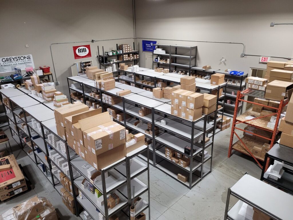 Stocked warehouse shelving at the Canada Controls building automation branch in Regina, Saskatchewan