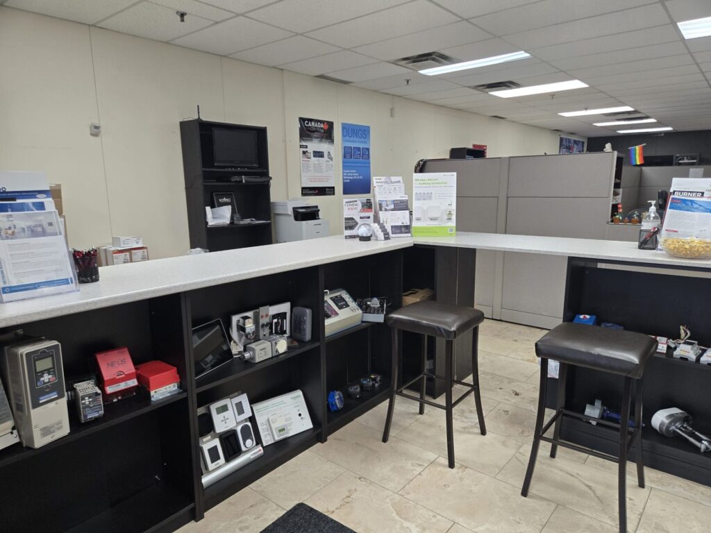 Sales counter at the Canada Controls building automation branch in Mississauga, Ontario, with control product displays and seating for contractors